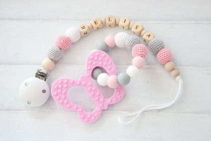 Rozā graušanas manta ar knupīša turētāju